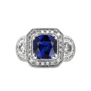 Cushion sapphire set on a diamond pave halo ring